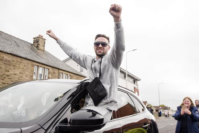 Josh Taylor arrives in his hometown of Prestonpans in East Lothian, and is greeted by fans after becoming four-belt undisputed champion. (Credit: Euan Cherry)