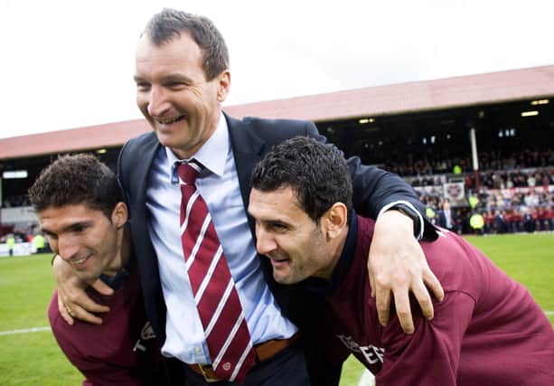 Hearts manager Csaba Laszlo (centre) celebrates with Bruno Aguiar (left) and Christos Karipidis. Pic: SNS