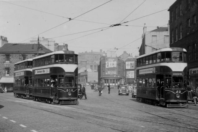 Edinburgh trams 216 and 52, with a third tram just behind, are seen in Tollcross in the 1950s.