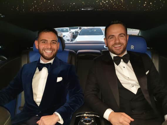 Calvin and Ryan travel in style in a Rolls-Royce