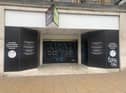 An empty shop tagged with graffiti on Princes Street