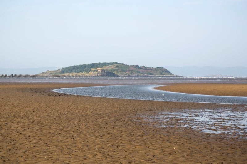 On the outskirts of Edinburgh, Cramond beach is known for its causeway to the island which is only available at low tide. When the sea is out, there is a huge expanse of sand popular with local dog walkers and families, but even when it's in the long promenade is a peaceful walk. Cramond village has a Roman fort, pub, and cafe for refreshments (4,400 searches)