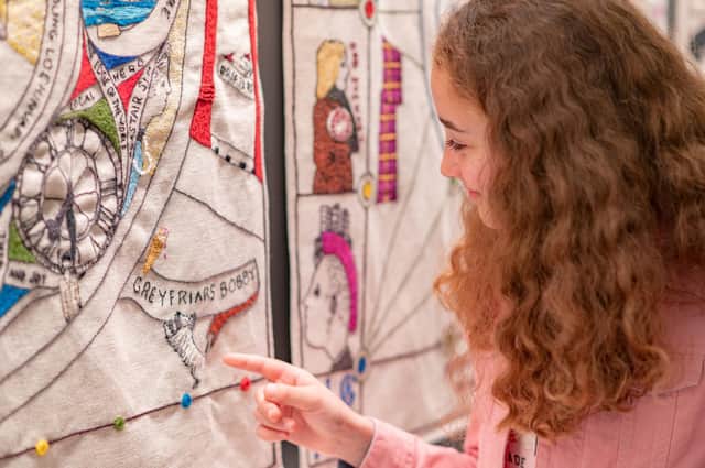 Cbeebies actress Mimi Robertson from Selkirk (Molly from Molly and Mack) has a closer look at the Great Tapestry of Scotland. Picture: Phil Wilkinson