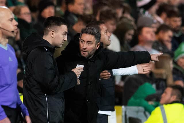 Hibs manager Lee Johnson has words with the fourth official at Tannadice
