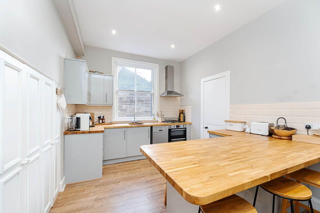 There is a fully equipped modern kitchen with a double sided breakfast bar and built-in pantry cupboards. A substantial utility room, WC, two large storage cupboards and hall with overhead pulley clothes dryer, are all located off the kitchen.