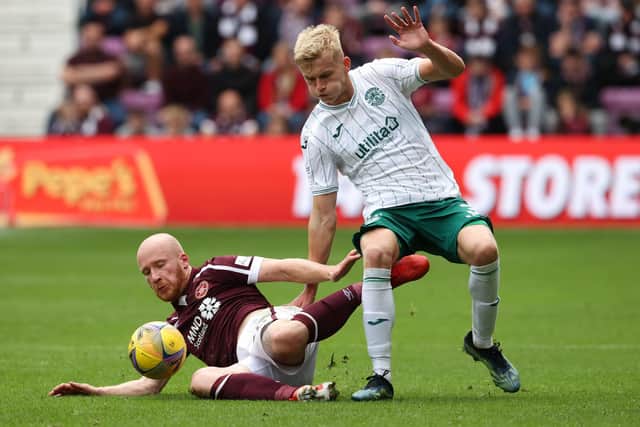 Hearts striker Liam Boyce and Hibs' Josh Doig battle for possession in the recent 0-0 draw at Tynecastle. Picture: SNS