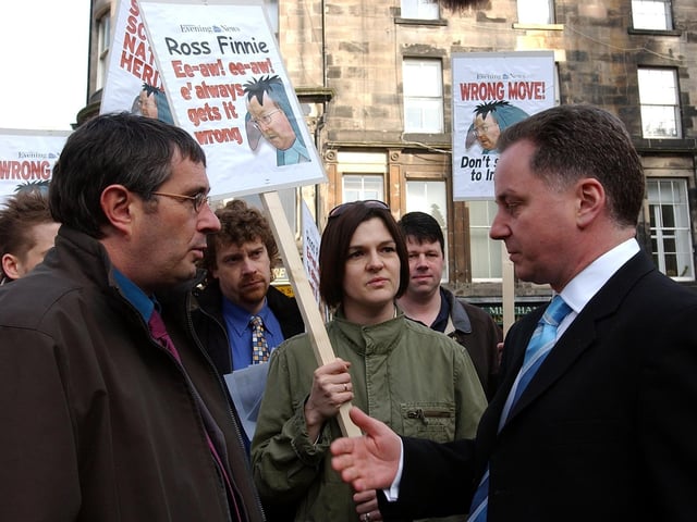 Labour First Minister Jack McConnell talks to union protesters during a campaign visit to Edinburgh.
Albie O'Neill, a negotiator for the PCS union and staff from Scottish Natural Heritage were opposing plans to relocate SNH headquarters from Edinburgh to Inverness.
Labour lost six seats at the election, reducing them to 50 MSPs, but Mr McConnell - who had become First Minister of the Labour-Lib Dem coalition government in November 2001- remained in office for another term before losing power narrowly to the SNP in 2007.