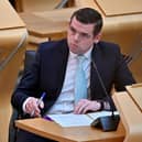 Douglas Ross Leader of the Scottish Conservative Party listens to First Minister Nicola Sturgeon during the statement at the Scottish Parliament in Edinburgh, on the next stage of lockdown easing on June 1, 2021