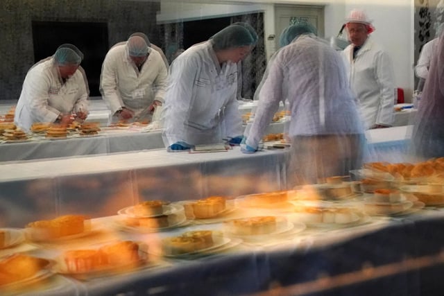 Judges are reflected in an oven at the 2022 World Scotch Pie Championship at Carnegie Conference Centre, Dunfermline.