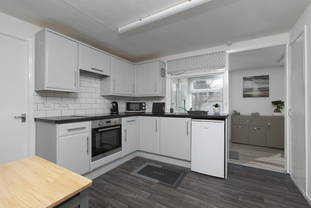 Fully equipped kitchen which is modern and well maintained with electric hob and fan oven. accessed from the kitchen is the porch area which could be used for a multitude of things and has previously been used as dining space.