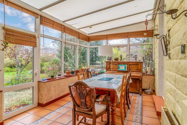 Double doors flow from from the dining room into a neighbouring conservatory that shares an open footprint with the kitchen. Enjoying lovely garden views, this charming space is ideal for relaxing, dining, and socialising.