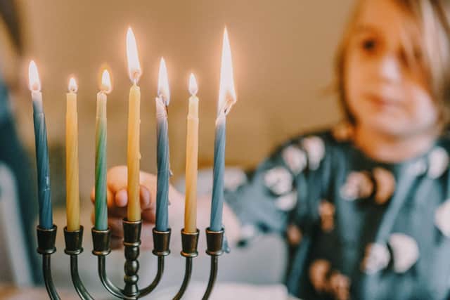 Children are often gifted with Hanukkah gelt during Hanukkah. Photo: Ksenia Chernaya / Pexels / Canva Pro.