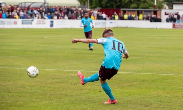 Finlay Pollock scores Hearts' first goal against Linlithgow Rose.
