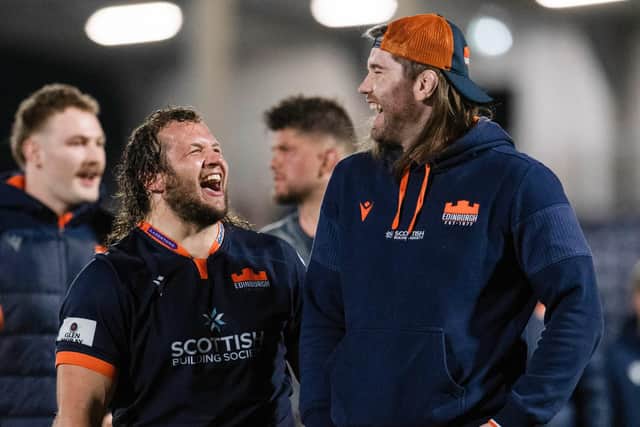 Edinburgh's Pierre Schoeman with injured team-mate Ben Toolis after the win over Bath. (Photo by Ross Parker / SNS Group)