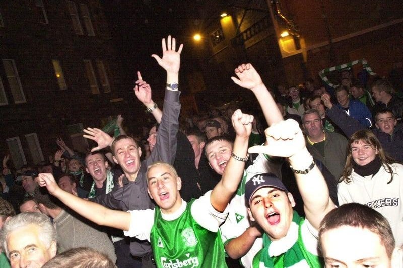 Joyous Hibs fans can be seen making their way down Albion Road following the landmark 6-2 victory against their rivals, Hearts, on 22 October 2000.