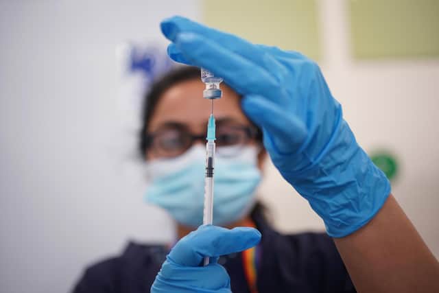 A nurse prepares a dose of the Pfizer Covid-19 vaccination at a vaccination site. Picture: PA
