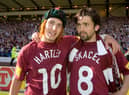 Rudi Skacel (left) celebrates Hearts' Scottish Cup win with team-mate Paul Hartley, who was red carded in the closing stages of extra time. Picture: SNS