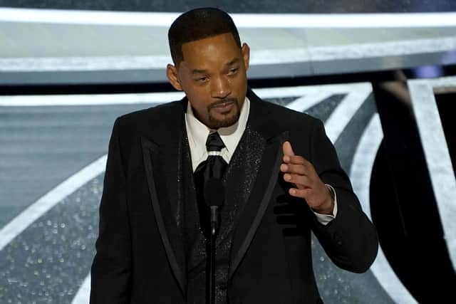 Will Smith cries as he accepts the award for best performance by an actor in a leading role for "King Richard" at the Oscars on Sunday, March 27, 2022, at the Dolby Theatre in Los Angeles. (AP Photo/Chris Pizzello)