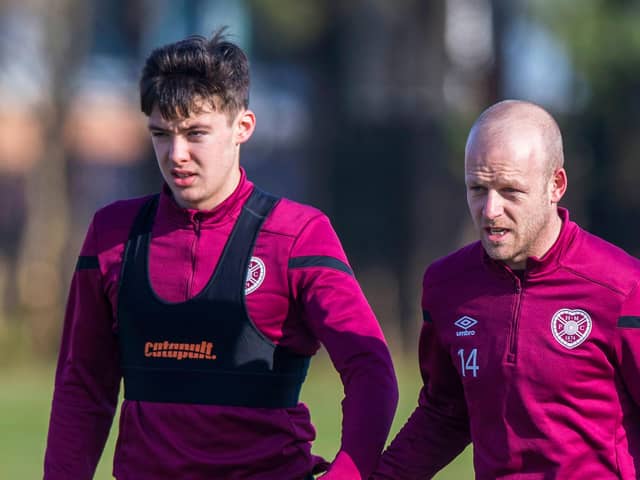 Aaron Hickey and Steven Naismith during their days together in the Hearts first-team. Picture: SNS