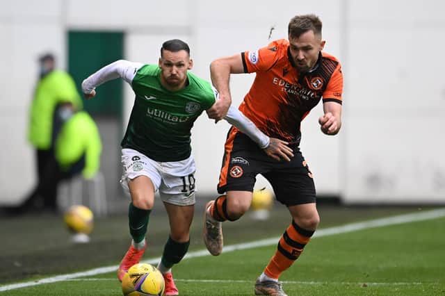 Hibs winger Martin Boyle tries to give Dundee United full-back Scott McMann the slip during the 3-0 defeat at Easter Road