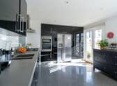 The kitchen/diner provides access via large glass doors into the private south facing garden and single garage.