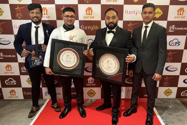 Habibur Khan (second from right) with his guests and the two national awards at the Mayfair hotel ceremony.