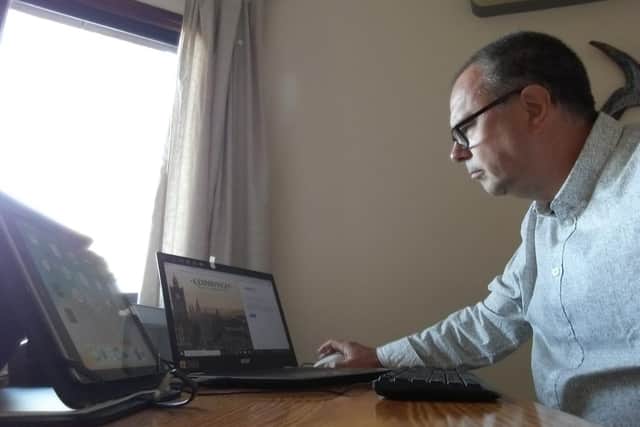 Donald Wilson is serving constituents and chairing meetings from Cyprus