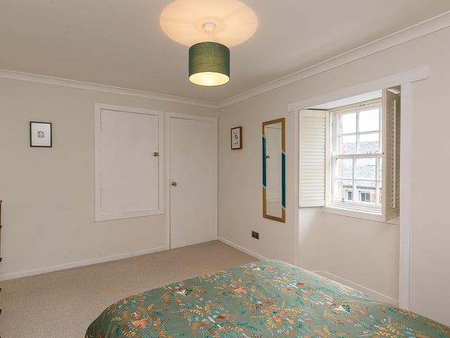 One of the bedrooms, both of which have excellent storage.