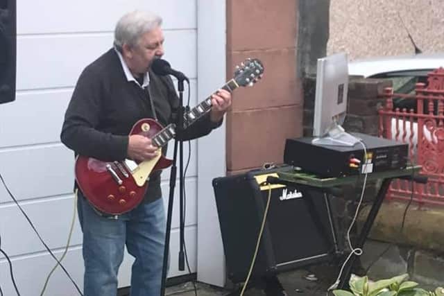 John Dickson, 71, has been performing to his neighbours in Granton.