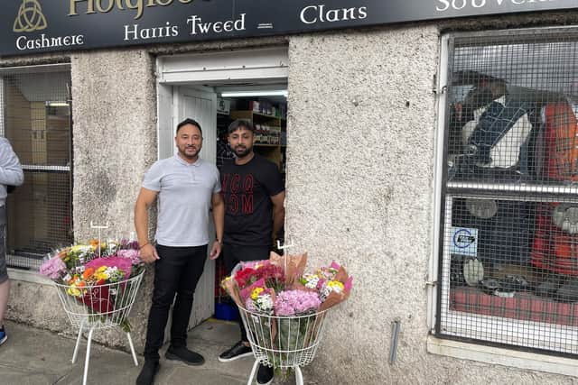 Rocky and Tyson Singh, who run Holyrood Gift Shop opposite the royal Edinburgh residence at Holyrood Palace, have been doing a roaring trade in camping chairs and tartan blankets over the past couple of days as crowds gathered to pay their respects to the late Queen. picture: Ilona Amos