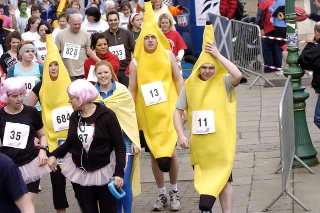 Runners can be seen here taking on the Meadows Marathon - some in regular running gear and others in fancy dress. Year: 2009.