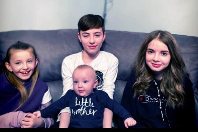 8 month-old Lucas with his brothers and sisters Kyle, 14, Ellie, 13 and Orla, 7 (Photo: Laura Campbell).