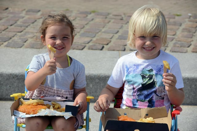 Meadow Defty, three, with brother Oscar Defty, five, enjoying their fish and chips.