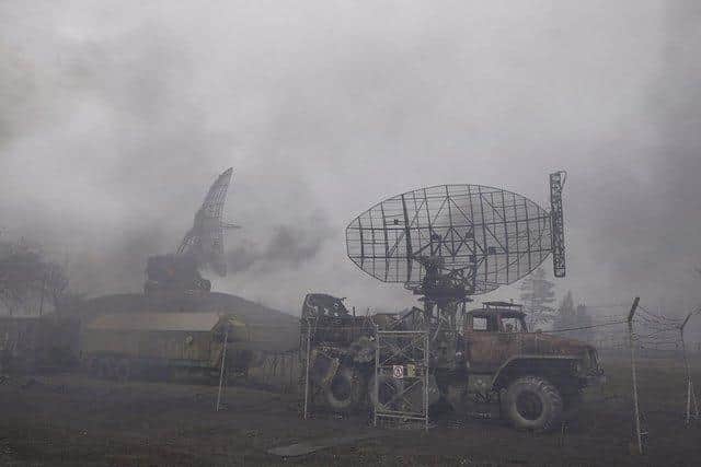 Smoke rise from an air defense base in the aftermath of an apparent Russian strike in Mariupol, Ukraine. Photo: AP Photo/Evgeniy Maloletka.