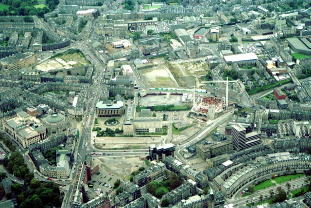 An aerial of the Lothian Road area of Edinburgh looking roughly south, October 1993.  Lothian Road runs up the left of the picture, with King's Stables Road at the bottom left, the  Usher Hall to the left and the West Approach Road to the right.  In the middle, construction is under way on the Edinburgh International Conference Centre.