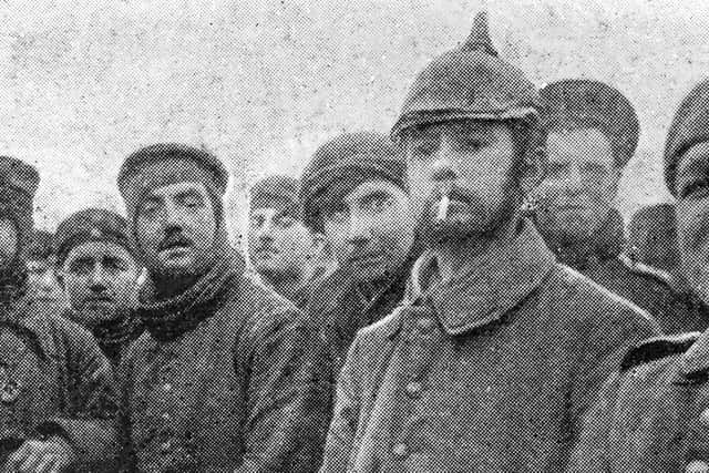 British and German troops pictured together on January 9, 1915, during a Christmas and New Year truce in the trenches of the Western Front (Picture: Hulton Archive/Getty Images)