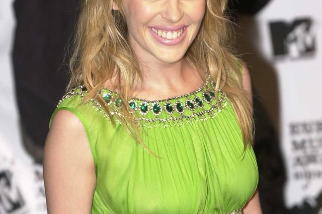 Australian singer, songwriter and actress Kylie Minogue smiled at fans as she walked down the red carpet.