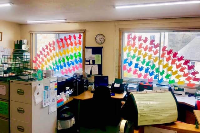 The rainbow colours were put in the window on Tuesday.