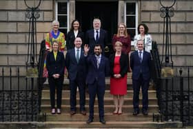 The full Cabinet assemble on the steps of Bute House, the First Minister's official residence, in Charlotte Square. 
First Minister Humza Yousaf is in the front and centre, with (left to right) on the back row: Angela Constance, Secretary for Justice and Home Affairs, Mairi McAllan, Secretary for Net Zero and Just Transition, Angus Robertson, Secretary for Constitution, External Affairs and Culture, Shirley-Anne Sommerville,  Secretary for Social Justice, and Mairi Geougeon, Secretary for Rural Affairs, Land Reform and Islands, and on the front row: Jenny Gilruth, Secretary for Education and Skills, Neil Gray, Secretary for Wellbeing, Economy, Fair Work and Energy, Shona Robinson, Deputy First Minister and Secretary for Finance and Michael Matheson, Secretary for NHS Recovery, Health and Social Care.