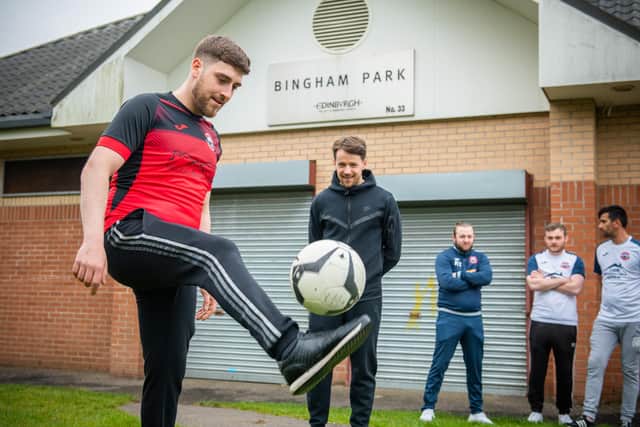 Scotland and Dundee United footballer and local lad, Marc McNulty (dressed all in black), with members of the Bingham Athletic team.