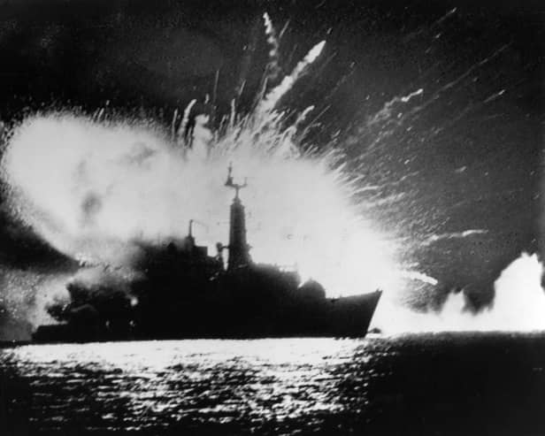 The missile magazines on board British Royal Navy Type 21 frigate, HMS Antelope, explode in San Carlos Water, off East Falkland, after attacks by the Argentine Air Force during the Falklands War, 24th May 1982. Photo: Martin Cleaver/Pool/Getty Images.