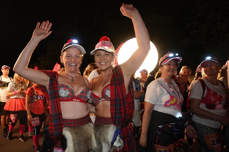 Two walkers keep their (Highland) spirits high in their eye-catching tartan outfits.