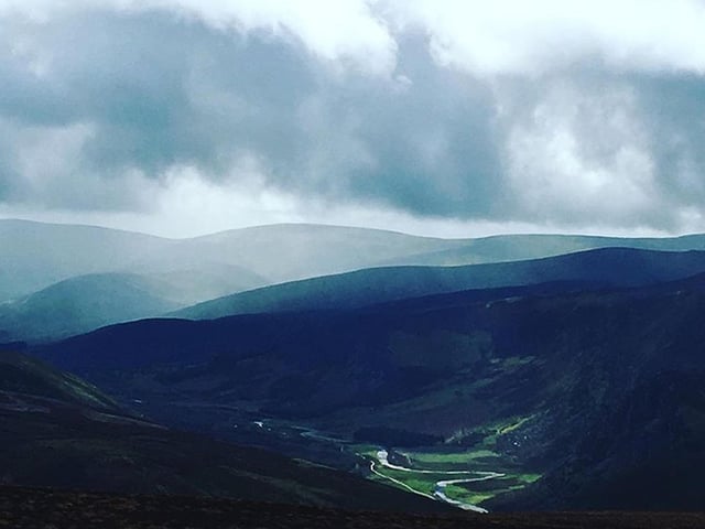 There is a long walk through the lovely glen before you reach the foot of the mountain, but get to the summit - there is a good path all the way - and you will be rewarded with views back down the glen (pictured) and over to the southern edge of the Cairngorms.