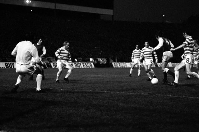Hibs' Pat Stanton is surrounded by Celtic players on his way to opening the scoring at Hampden