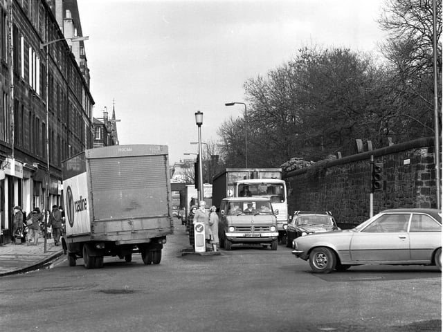 Pedestrians stuck on the island as the traffic speeds past at the junction of Ardmillan Terrace and Dalry Road in Edinburgh, February 1980.