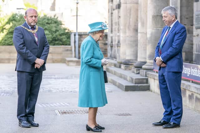 Queen Elizabeth with Lord Provost Frank Ross (L) and Principal and Vice-Chancellor Peter Mathieson (R), during a visit to the Edinburgh Climate Change Institute, as part of her traditional trip to Scotland for Holyrood Week (Photo by Jane Barlow - WPA Pool/Getty Images).