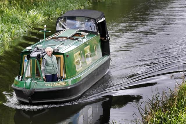 A canal boat heads from Edinburgh along the Union Canal towards Falkirk (Picture: Danny Lawson/PA)