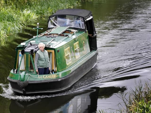 A canal boat heads from Edinburgh along the Union Canal towards Falkirk (Picture: Danny Lawson/PA)