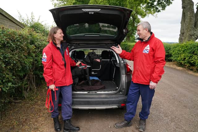 Emma Dryburgh and her dog Dougal chat with John Miskelly at his home in Falkland, Fife, John leads a specialist dog team that search out and find dead bodies. He and his team are on standby to help in Ukraine
Pic: Andy Milligan
