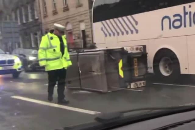 The road sweeper vehicle was videoed flat on its side in the middle of South Charlotte Street, Edinburgh